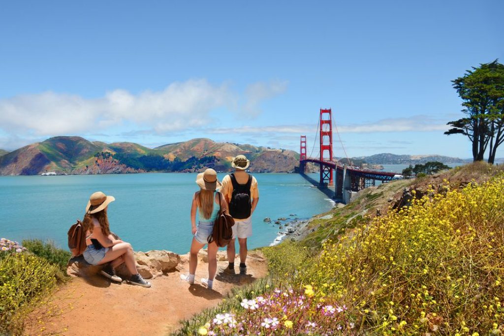 Why do tourists go to California?